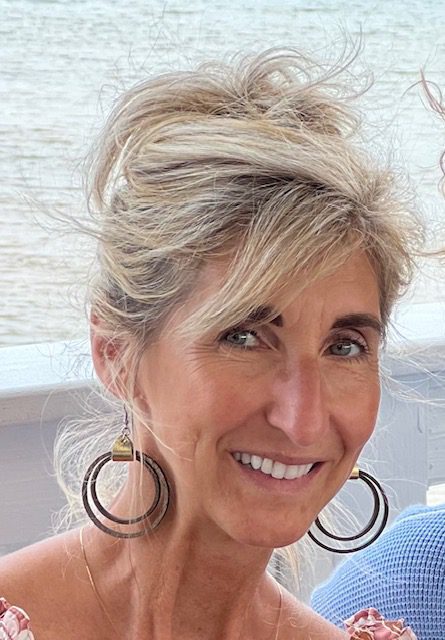 Woman with styled hair and earrings
